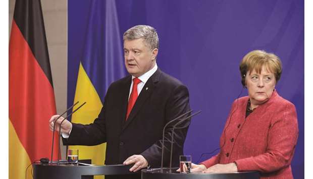 Merkel and Poroshenko at their joint press conference after talks in Berlin.