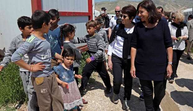 Paris' mayor Anne Hidalgo (1st-R) visits the camp for internally Yazidi displaced persons (IDP) in the Sharya area, some 15 kilometres from the northern Iraqi city of Dohuk.