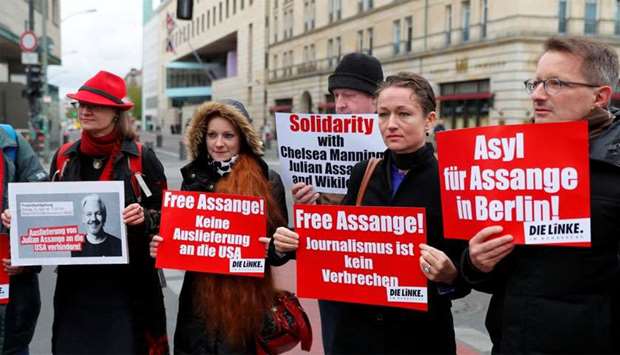 Supporters of WikiLeaks founder Julian Assange protest against his arrest, near the British embassy in Berlin