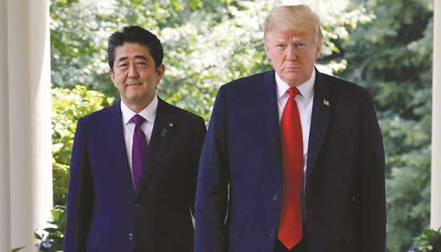 US President Donald Trump and Shinzo Abe, Japanu2019s prime minister, walk out of the Oval Office in the Rose Garden of the White House in Washington, DC (file). Japan is finally stepping into the ring for a fight it had managed to dodge for more than two years: Bilateral trade talks with Trump.