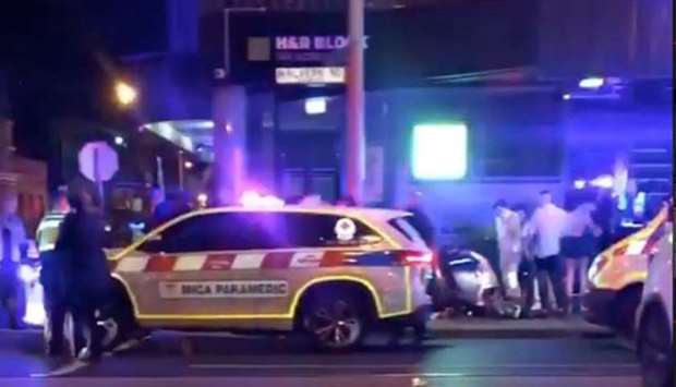 Police and rescue services are seen following a shooting incident outside a nightclub, in Prahran, Melbourne, Australia in this still frame taken from social media video early Apri