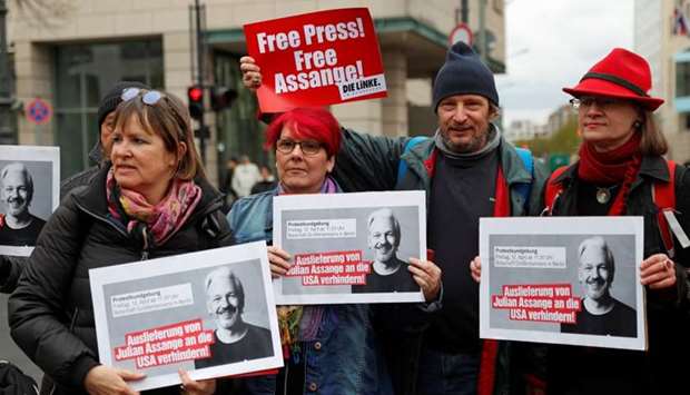 Supporters of WikiLeaks founder Julian Assange protest against his arrest, near the British embassy in Berlin, Germany