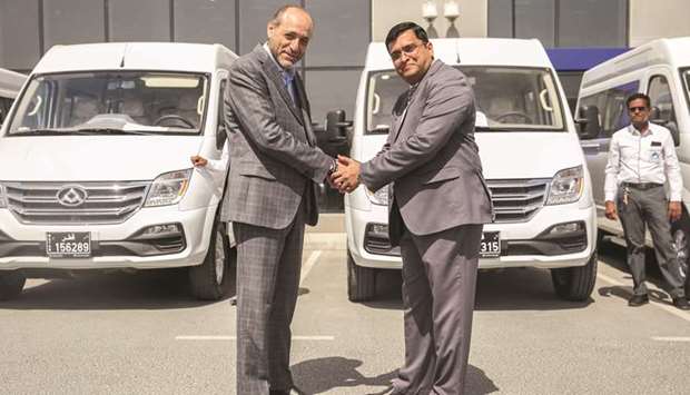Auto Class Cars and Tri Logistics officials after signing the deal.