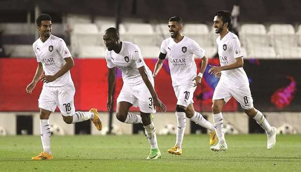 Akram Afif, Abdelkarim Hassan, Hassan al-Haydous and Ali Asad celebrate their win over Umm Salal yesterday.