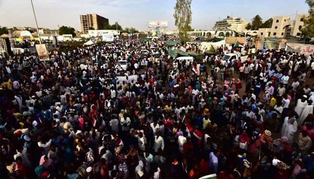 Sudanese demonstrators gather near the military headquarters in the capital Khartoum