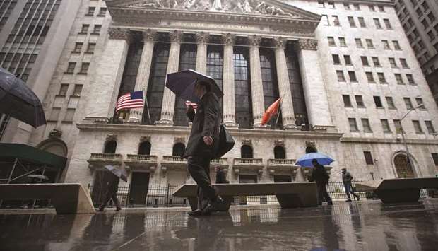 Pedestrians walking past the New York Stock Exchange (file). Investors betting on industrial stocks this year have been rewarded, with the group among the best-performing sectors so far, but that strength will be tested in the coming weeks as companies report results.