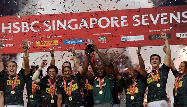 South Africa players celebrates after winning the Singapore Rugby Sevens Cup in Singapore yesterday. (AFP)