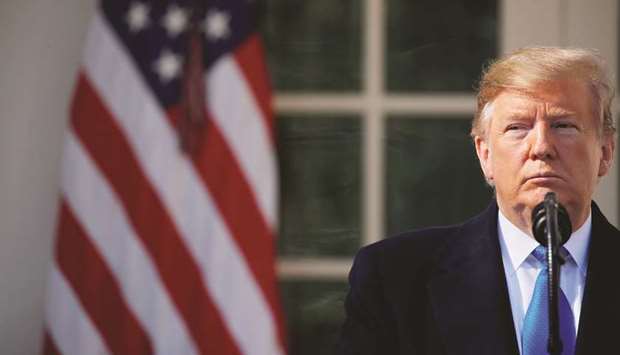 US President Donald Trump pauses during his declaration of a national emergency at the US-Mexico border during remarks about border security in the Rose Garden of the White House in Washington yesterday. Even as it urges the rest of the world to do more to boost global growth, the US is doubling down on the u201cAmerica Firstu2019u2019 trade policies that have become a major drag on demand.