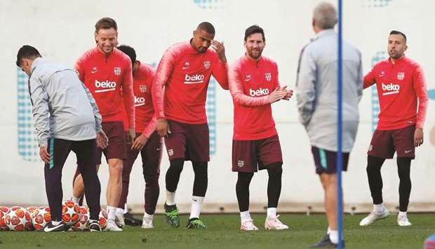 Barcelonau2019s Lionel Messi (second from right) takes part in a training session with teammates on the eve of their UEFA Champions League quarter-final second-leg match against Manchester United in Barcelona, Spain, yesterday. (Reuters)