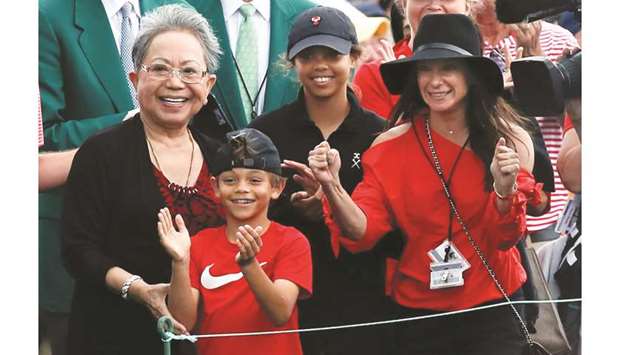 Tiger Woodsu2019 family, daughter Sam Alexis, son Charlie Axel, mother Kultida Woods (L) and girlfriend Erica Herman, smile as he approaches them after he won the 2019 Masters.