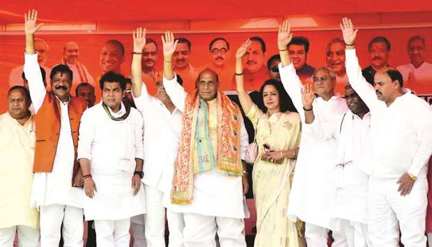 Federal Home Minister Rajnath Singh and BJP MP and the partyu2019s Lok Sabha candidate from Mathura, Hema Malini, and other party leaders wave at supporters during an election rally in Mathura yesterday.