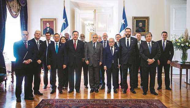 Chilean President Sebastian Pinera poses at La Moneda Presidential Palace in Santiago yesterday with the foreign ministers of nations of the Lima Group who are meeting over the Venezuelan crisis in the Chilean capital.