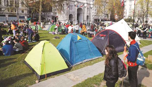 Environmental activists erect tents near Marble Arch during a demonstration by the Extinction Rebellion group in London yesterday.