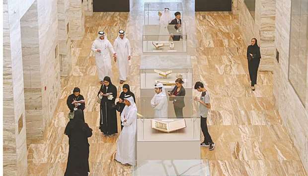 Visitors explore the displays at the Heritage Library.