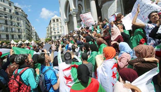 Students take part in a protest seeking the departure of the ruling elite in Algiers, Algeria