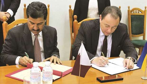 HE Dr Ahmed bin Hassan al-Hammadi and Sergiy Korsunsky signing the MoU.