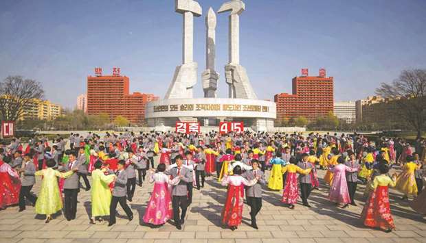 Students participate in a mass dance performance as part of celebrations marking the anniversary of the birth of late North Korean leader Kim Il-sung, known as the u2018Day of the Sunu2019, at the Monument to the Workeru2019s Party Founding, in Pyongyang yesterday.