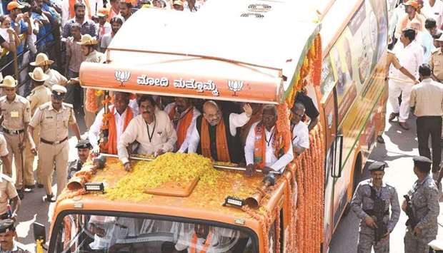 Bharatiya Janata Party chief Amit Shah takes part in a road show on the last day of campaigning for the second phase of Lok Sabha polls, in Tumakuru in Karnataka yesterday.