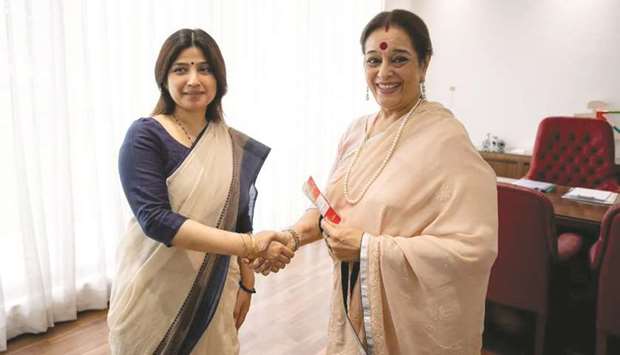 Poonam Sinha, wife of actor-turned-politician Shatrughan Sinha (right), is welcomed by Samajwadi Party MP Dimple Yadav after she joined the party, in Lucknow yesterday.