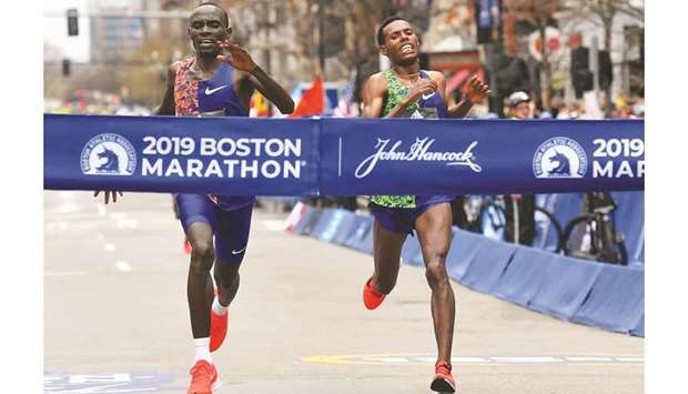 Kenyau2019s Lawrence Cherono (left) crosses the finish line ahead of Ethiopiau2019s Lelisa Desisa during the 123rd running of the Boston Marathon in Boston, United States, on Monday. (Reuters)