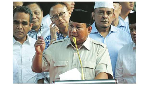 Indonesian presidential candidate Prabowo Subianto speaks to the media after polls closed in Jakarta.