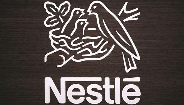 A Nestle birds nest logo is displayed on a wooden panel ahead of a news conference announcing the companyu2019s full year results in Vevey, Switzerland. European shares ended higher yesterday as short covering kicked in ahead of a long Easter weekend and strong quarterly results including those from Unilever and Nestle tempered data showing eurozone  businesses unexpectedly slowed this month.