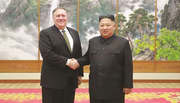 North Koreau2019s leader Kim Jong-un (right) shaking hands with US Secretary of State Mike Pompeo at the Paekhwawon State Guesthouse in Pyongyang in a file picture.
