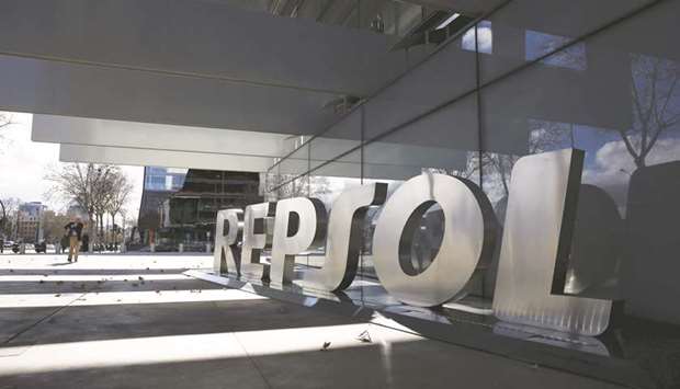 A man walks past the logo of Repsol at its headquarters in Madrid. The Spanish oil company has been swapping fuel and waiving payments due from a joint venture with PDVSA in exchange for crude, even as the US rolled out new sanctions aimed at ousting Venezuelau2019s socialist President Nicolas Maduro.