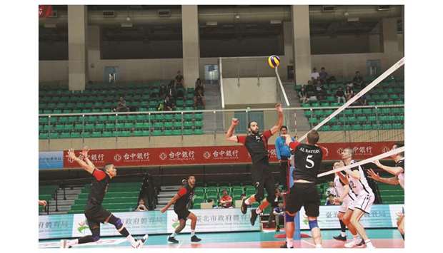 Action from the Asian Menu2019s Club Volleyball Championship match between Qataru2019s Al Rayyan (in black) and Kazakhstanu2019s TNC Kazchrome VC (in white) at the University of Taiwan Gymnasium yesterday.