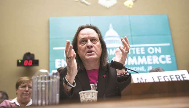 John Legere, chief executive officer of T-Mobile US, speaks during a House Energy & Commerce subcommittee hearing on the the T-Mobile and Sprint merger on Capitol Hill in Washington, DC on February 13. Legere met antitrust division chief Makan Delrahim and other officials on Thursday to defend the deal after staff attorneys vetting the merger informed the companies of their concerns, sources said.
