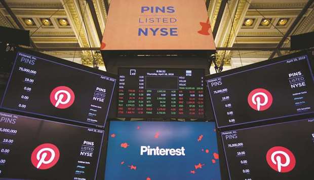 Monitors display Pinterest signage during the companyu2019s initial public offering on the floor of the New York Stock Exchange on Thursday. Pinterest climbed as much as 33% in its trading debut after raising $1.4bn in the yearu2019s second-biggest US initial public offering, pinning investor hopes on a continuing listing surge.