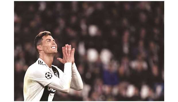 Juventusu2019 Portuguese forward Cristiano Ronaldo reacts during the UEFA Champions League quarter-final second leg match against Ajax Amsterdam on April 16.