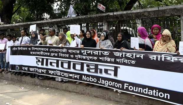 Bangladeshis attend a protest in Dhaka following Nusrat Jahan Rafi's murder by being set on fire after she had reported a sexual assault.