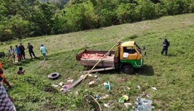 The truck was driving on an ascent in Tabuk City in Kalinga province when it stalled and rolled backwards into a 5-metre-deep ravine. Photo courtesy of Kalinga PPO