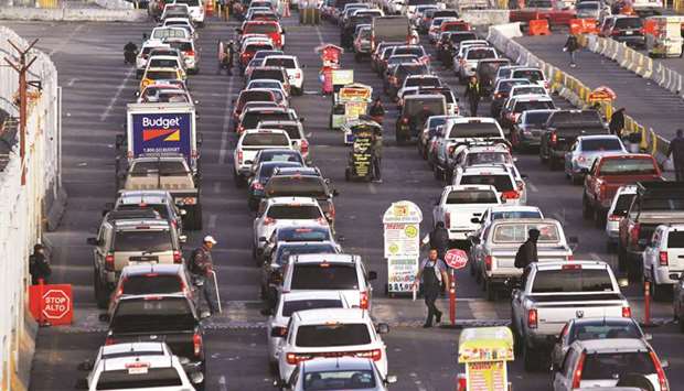 Cars queue up awaiting inspections by US border patrol officers to enter the US from Mexico at the San Ysidro point of entry, in Tijuana, Mexico.