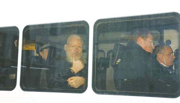 WikiLeaks founder Julian Assange is seen in a police van, after he was arrested by British police, in London, Britain, on April 11, 2019.