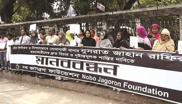 Bangladeshis attend a protest in Dhaka yesterday, following Nusrat Jahan Rafiu2019s murder by being set on fire after she had reported a sexual assault.