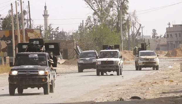 Vehicles belonging to Libyan fighters loyal to the Government of National Accord (GNA) are pictured during clashes with forces loyal to strongman Khalifa Haftar, south of the capital Tripoliu2019s suburb of Ain Zara, yesterday.