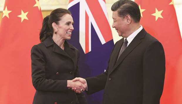 Chinese President Xi Jinping shakes hands with New Zealandu2019s Prime Minister Jacinda Ardern before their meeting at the Great Hall of the People in Beijing yesterday.