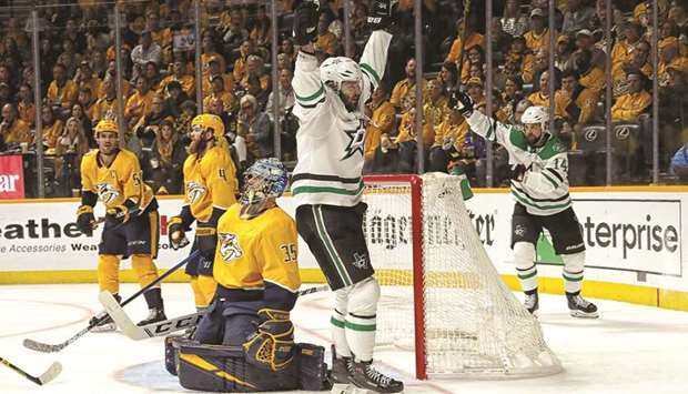 Alexander Radulov (second from right) of the Dallas Stars celebrates with teammate Jamie Benn (right) after scoring against goalie Pekka Rinne (centre) of the Nashville Predators in Game Five of the Western Conference First Round during the 2019 NHL Stanley Cup Playoffs in Nashville on Saturday. (AFP)