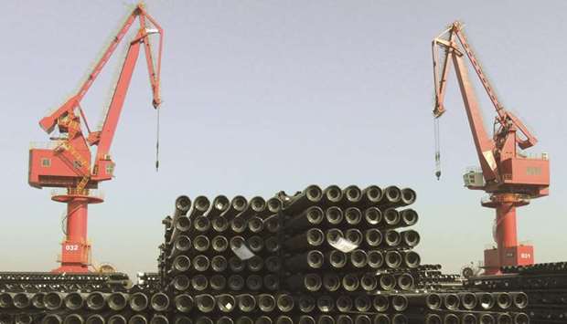 Cranes are seen above piles of steel pipes to be exported at a port in Lianyungang. Chinau2019s response to a slowing economy is fuelling hopes that itu2019s the turn of steel stocks to benefit, as investment in infrastructure and real estate bolsters the industryu2019s most crucial drivers of demand.