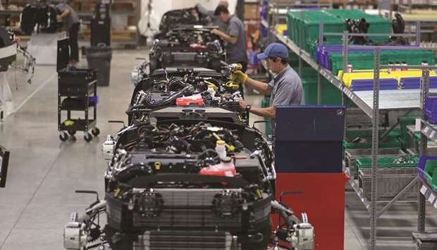Workers assemble Venice model roadster vehicles at the Vanderhall Motor Works manufacturing facility in Provo, Utah. Ahead of the US GDP report, data will show the strength of durable goods orders in March, with the median forecast in the Bloomberg survey for a 0.7% gain after a 1.6% decline.