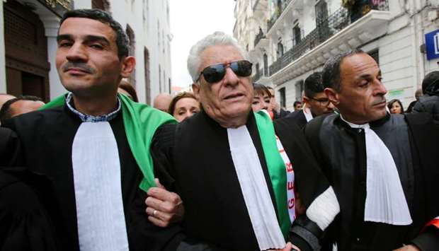 Mustapha Bouchachi, a rights activist and lawyer, marches with others during a protest to demand the immediate resignation of President Abdelaziz Bouteflika, in Algiers, Algeria on March 23.