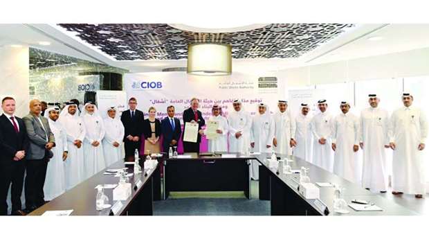 Officials of Ashghal, Chartered Institute of Building (CIOB) with and other dignitaries at the signing ceremony.