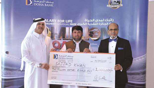 Doha Bank Group CEO Dr R Seetharaman with the latest winner of Al Dana saving scheme draw.