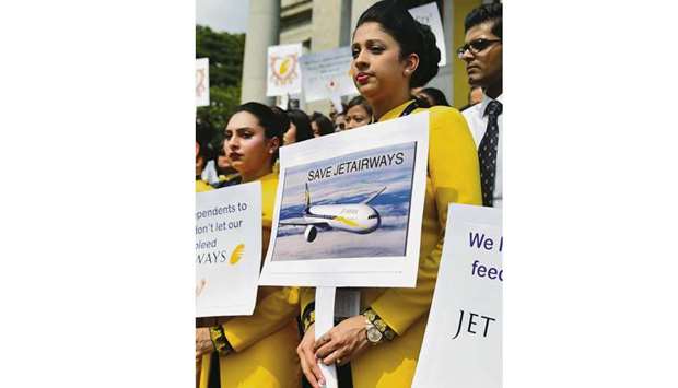 Employees of Jet Airways take part in a peaceful gathering to appeal to the government and lenders to bail the airline from bankruptcy and save the jobs of thousands of its employees, in Bengaluru yesterday.