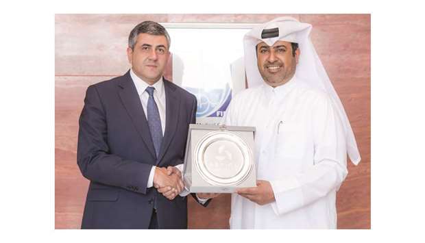 Director General of Aspire Logistics Abdullah Nasser al-Naimi (right) gifted a memento to UN World Tourism Organization Secretary-General Zurab Pololikashvili.