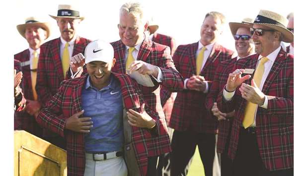 Pan Cheng-tsung of Taiwan is presented with a jacket after winning the 2019 RBC Heritage at Harbour Town Golf Links in Hilton Head Island, South Carolina. (Getty Images/AFP)