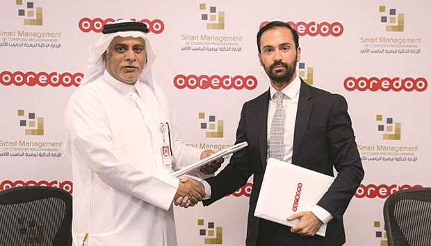 Ooredoo COO Yousuf Abdulla al-Kubaisi and Smart Management IT Solutions general manager Andrew Doxsey after signing the agreement.