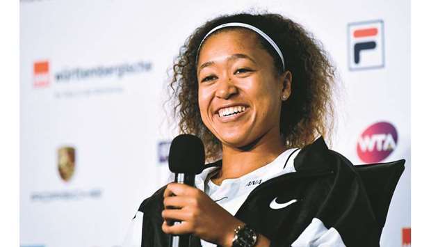 Japanu2019s Naomi Osaka is all smiles as she gives a press conference ahead of the WTA Tennis Grand Prix in Stuttgart, Germany. (AFP)